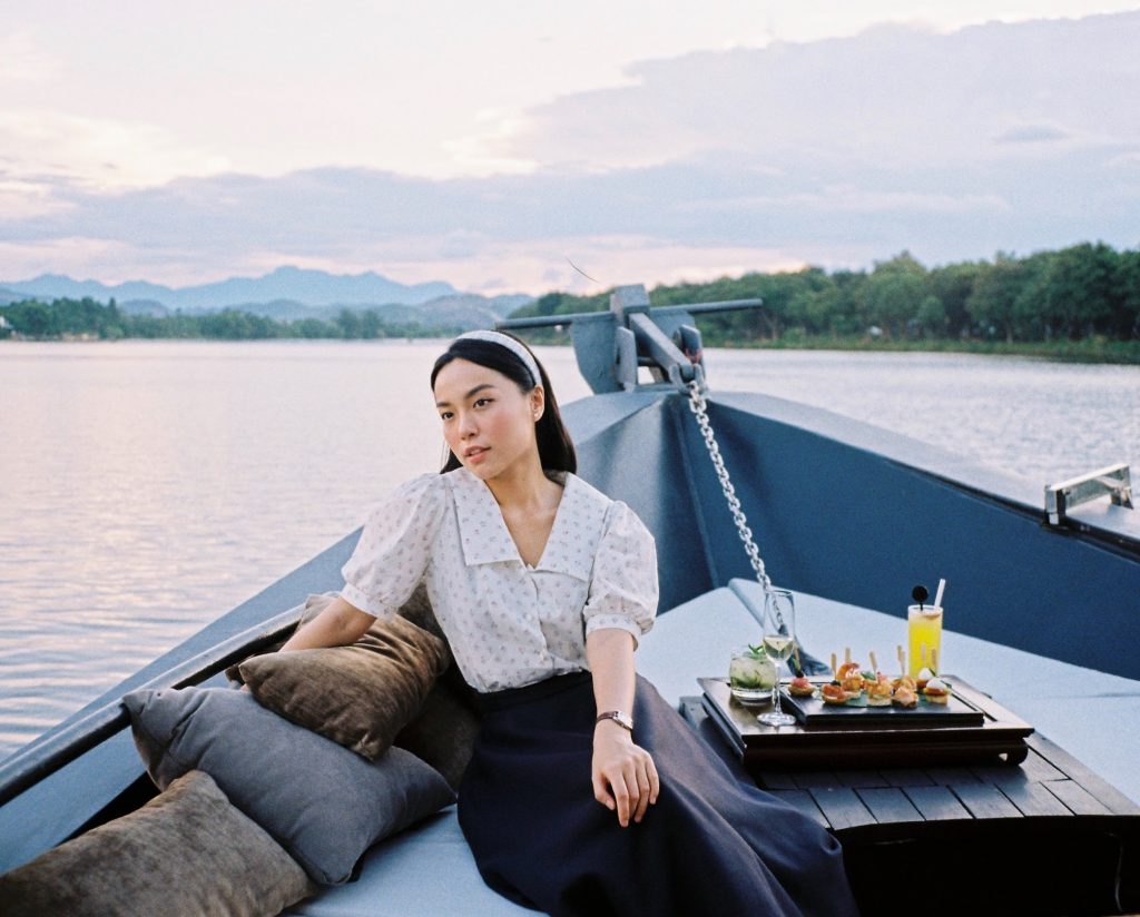 Vietnamese actress Le Ha Truc cruising the Perfume River at Azerai La Residence, Hue