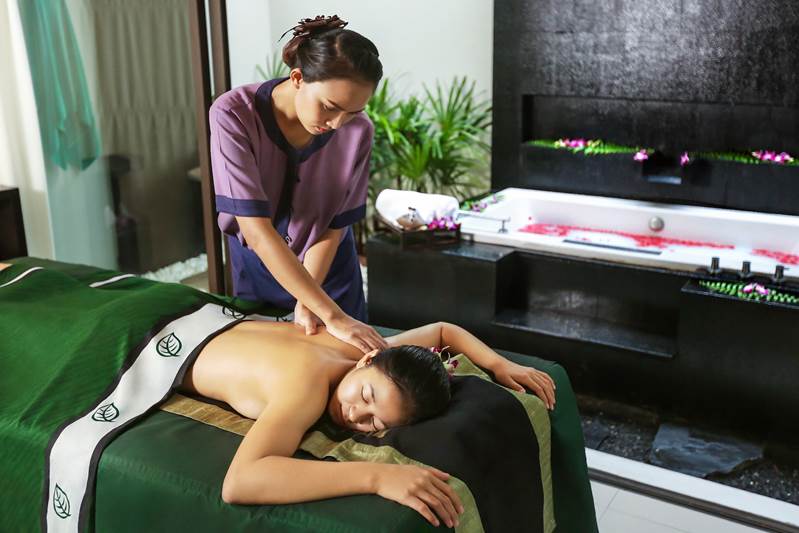 Relaxing with a massage treatment at Banyan Tree Spa Samui